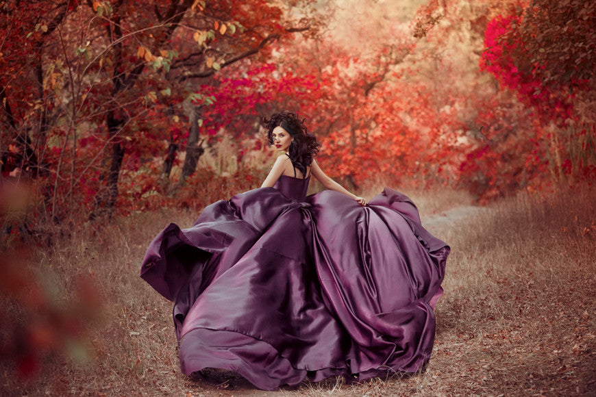 A-woman-with-purple-dress-in-the-maple-forest