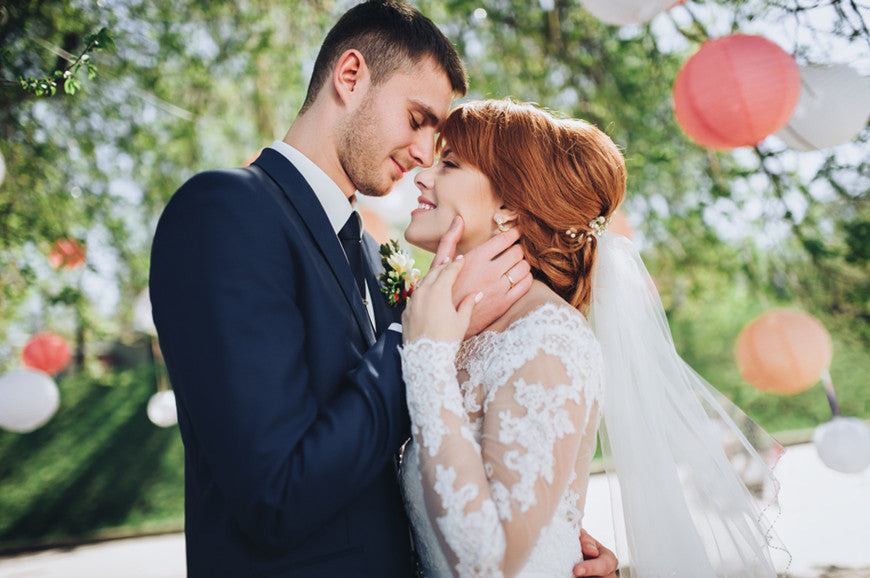 Bride-and-groom-at-wedding-Day-walking-Outdoors-on-spring-nature