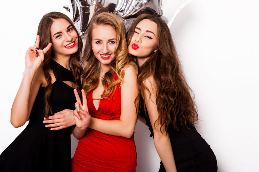 Three-best-friends-celebrate-birthday-indoor-wearing-elegant-evening-dress-and-have-bright-make-up