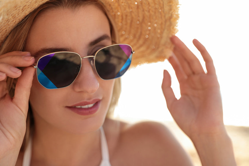 woman-wearing-sunglasses-outdoors-on-sunny-day