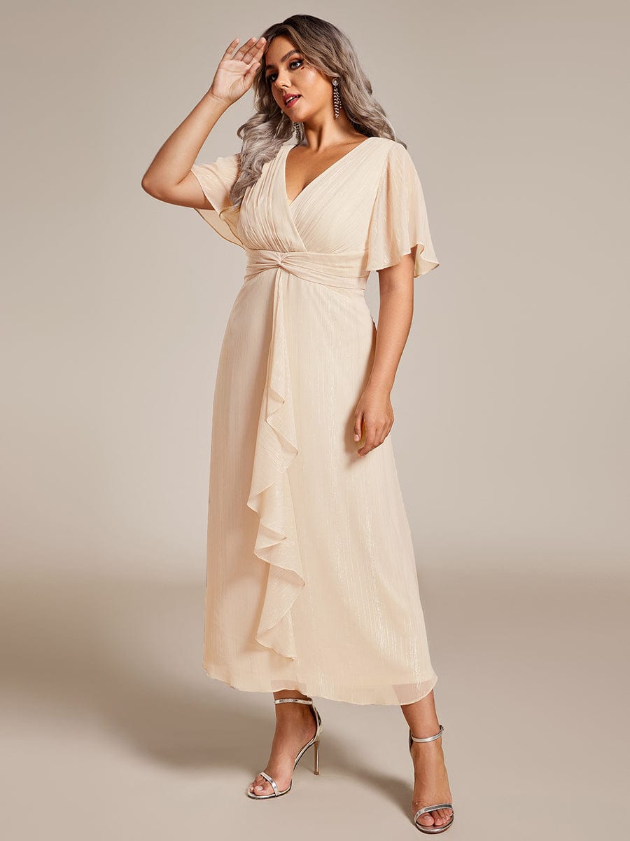 Plus Size Silver Metallic Fabric V-Neck A-Line Dress featuring Delicate Ruffled Hem #color_Champagne